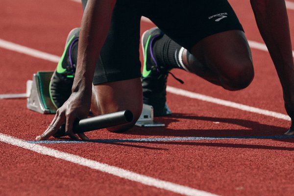 What are the technical considerations for designing custom footwear for professional sprinters?